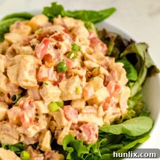 Chicken BLT Salad on a bed of lettuce.