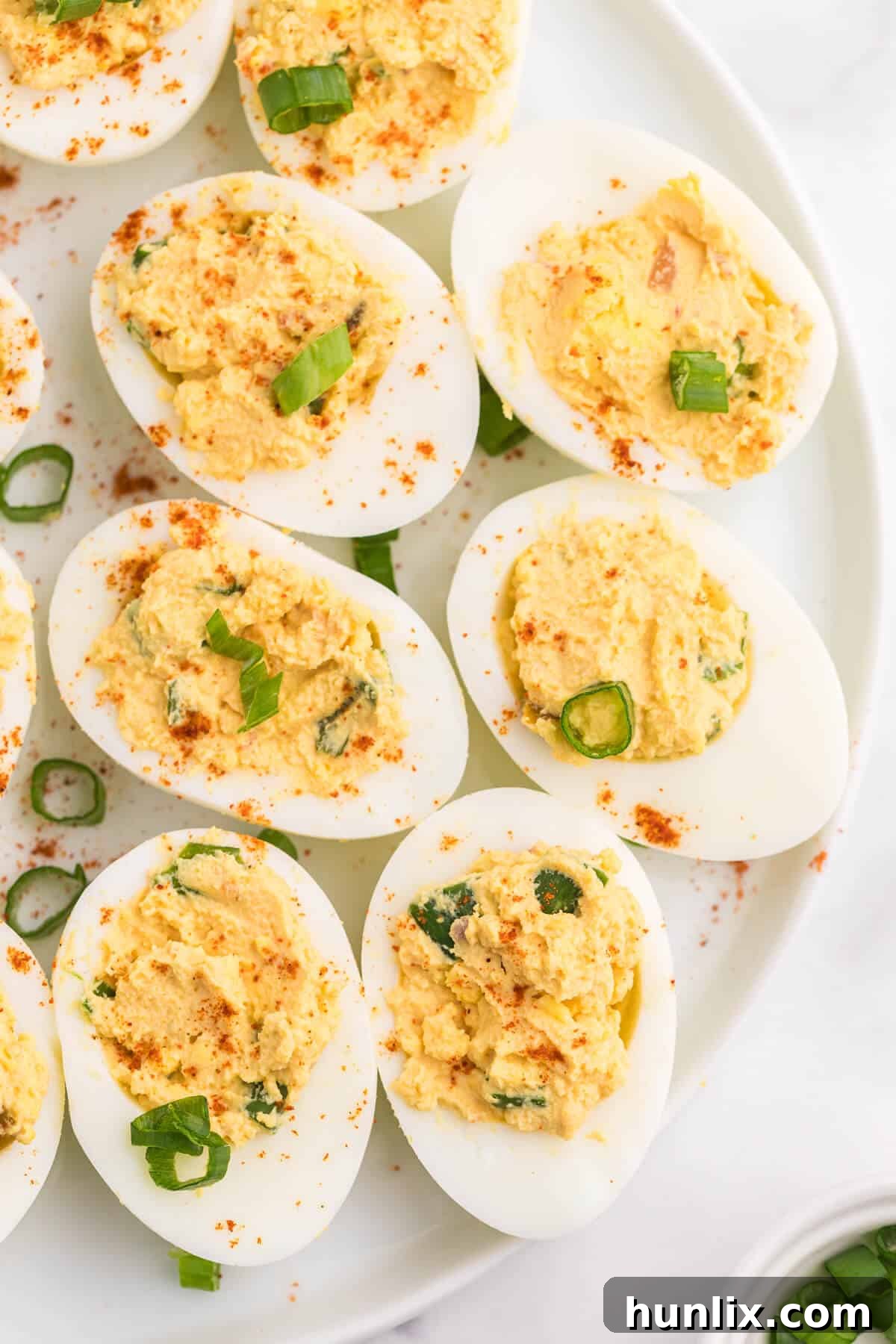 Fiesta Deviled Eggs 3 Salsa Deviled Eggs - a spicy kick to a popular appetizer recipe! This recipe is always gobbled up quickly.