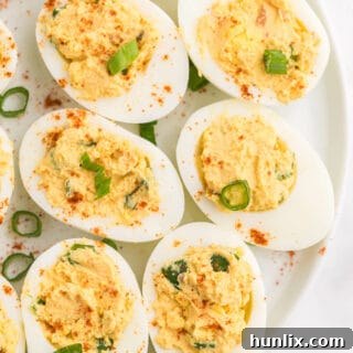 Salsa Deviled Eggs - a spicy kick to a popular appetizer recipe! This recipe is always gobbled up quickly.