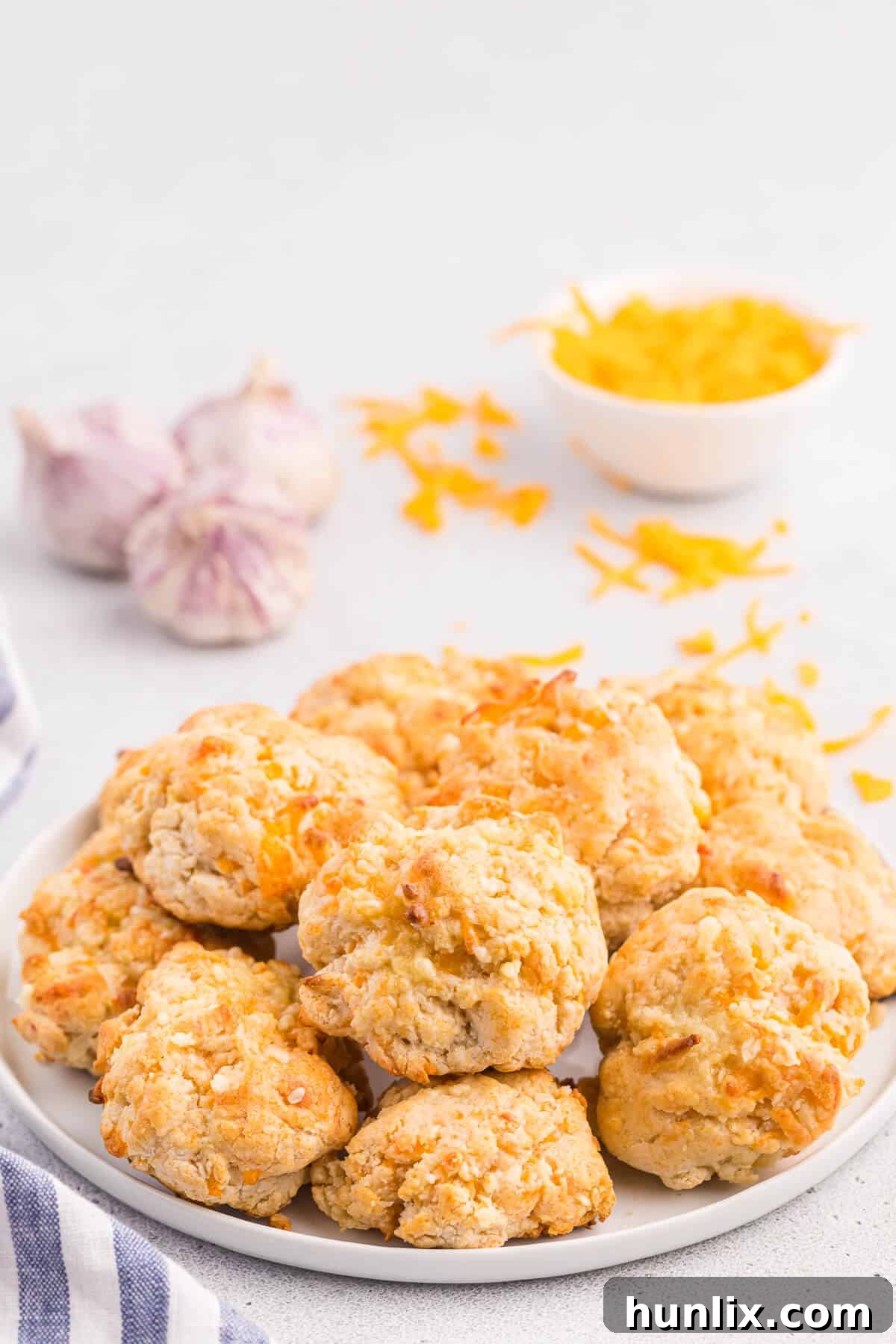 Buttery Garlic Cheese Biscuits 3 A close-up of cheesy garlic biscuits, showing their fluffy texture and golden-brown tops.
