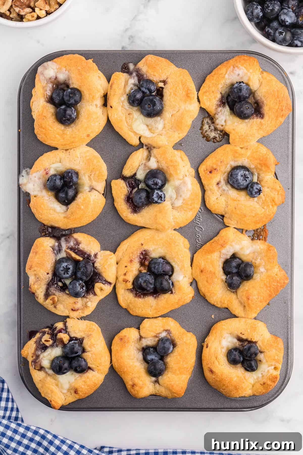 Blueberry Cheese Tarts - Sweet and savory combine in these delicate tarts! Serve as a sweet appetizer or a mini dessert.