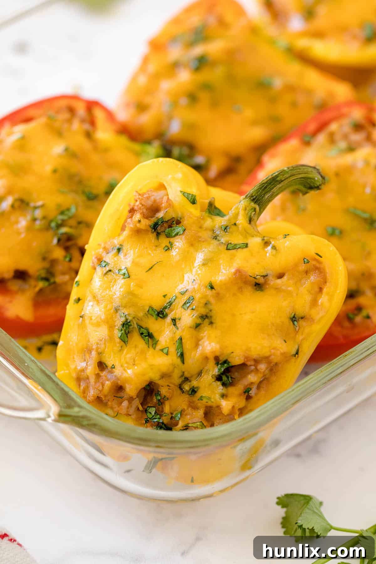 A dish of Mexican stuffed peppers baking in the oven.