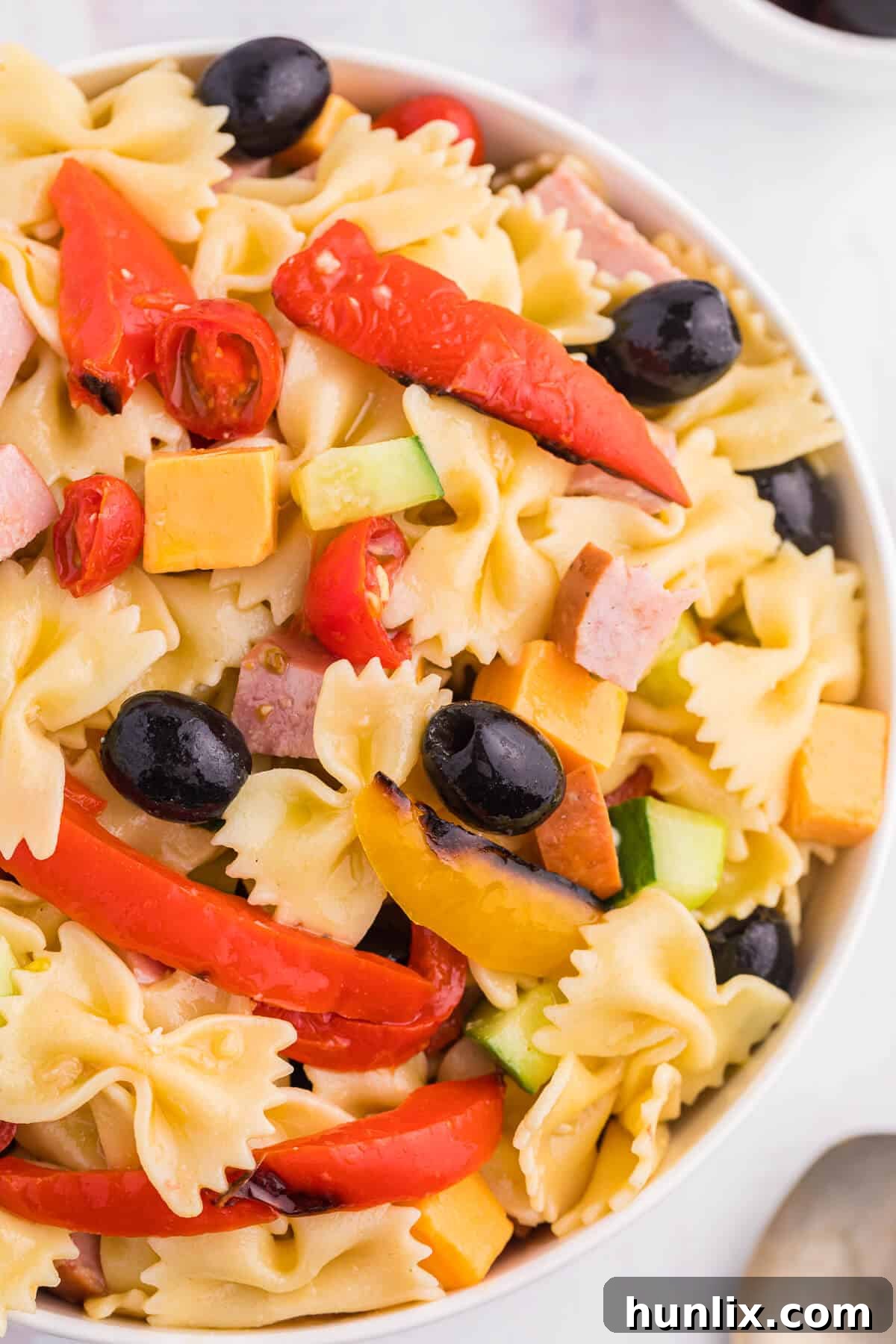 Blistered Bell Pepper Pasta Toss 4 A vibrant bowl of roasted pepper pasta salad, ready to be served.