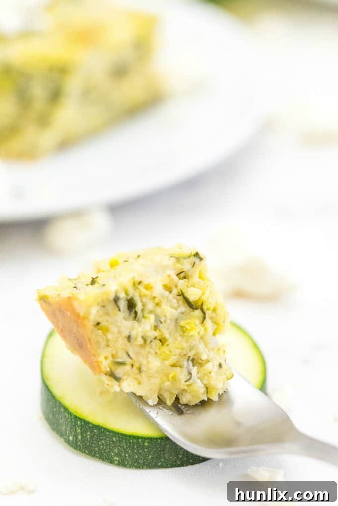 A single serving of Cheesy Zucchini Bake, warm and inviting, on a plate ready to be enjoyed.