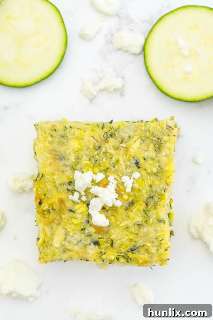 Another mouthwatering close-up of the Cheesy Zucchini Bake, showcasing its textures and cheesy goodness.
