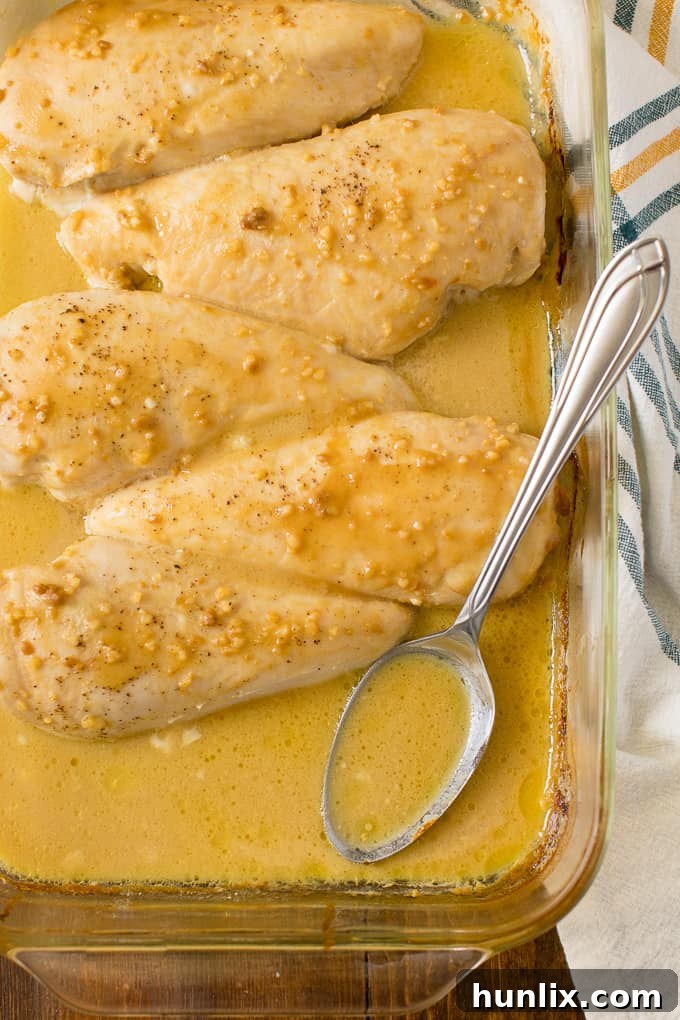 Golden Honey Garlic Chicken 6 The finished Honey Garlic Chicken dish in a pan, with a serving spoon ready to dish out portions.