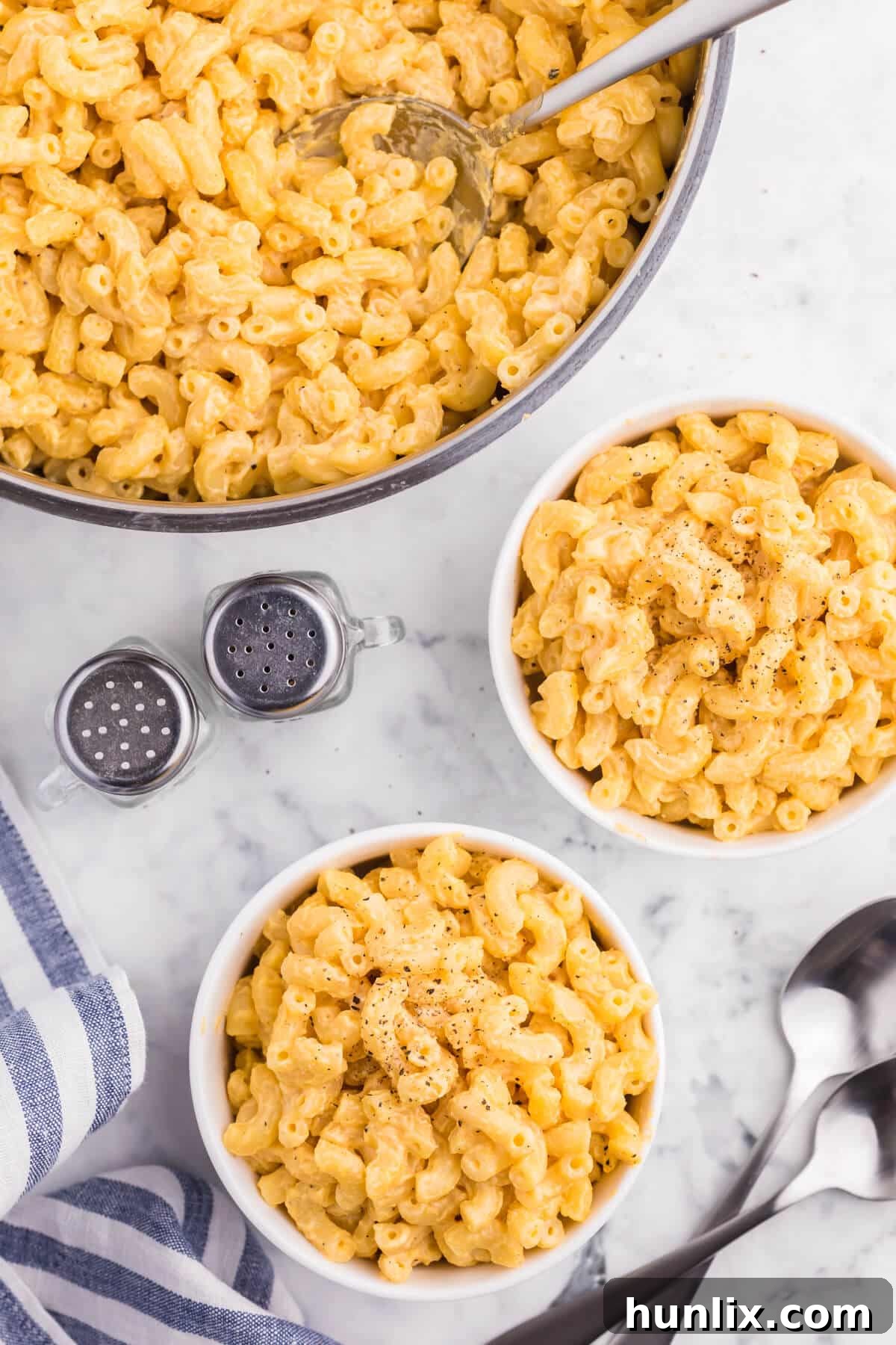Two bowls of perfectly prepared stovetop mac and cheese.