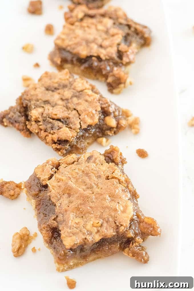 Maple Syrup Bars - If you like butter tarts, then you will LOVE this dessert! Maple + butter tarts are combined to make these incredible, sweet and delicious squares. Oh Canada!