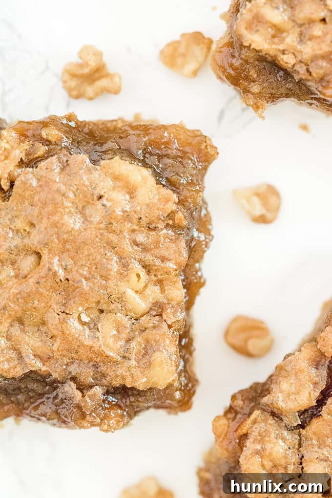 Maple Syrup Bars - If you like butter tarts, then you will LOVE this dessert! Maple + butter tarts are combined to make these incredible, sweet and delicious squares. Oh Canada!