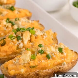 Buffalo Twice-Baked Potatoes on a white platter, ready to be enjoyed.