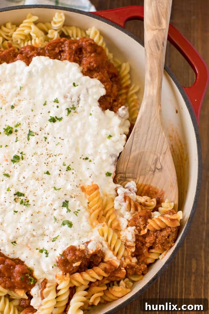 The recipe in a pan with a wooden spoon.