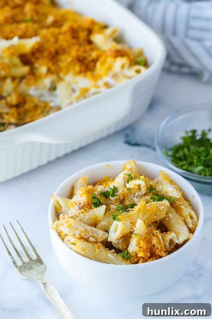 Tuna Noodle Casserole - creamy noodles topped with a crunchy cheesy topping. Chip dip is the secret ingredient!