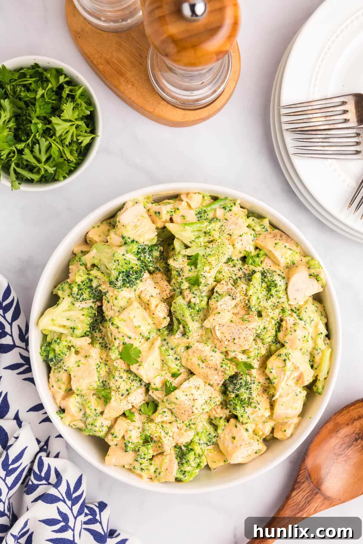 Ultimate Cheesy Chicken Broccoli Bake 2 Cheesy chicken and broccoli in a bowl.