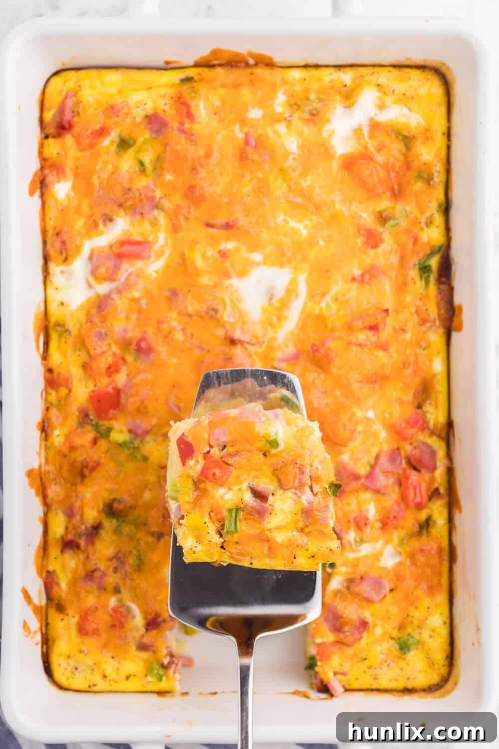 Golden Hash Brown Quiche 4 A slice of the recipe on a spatula.