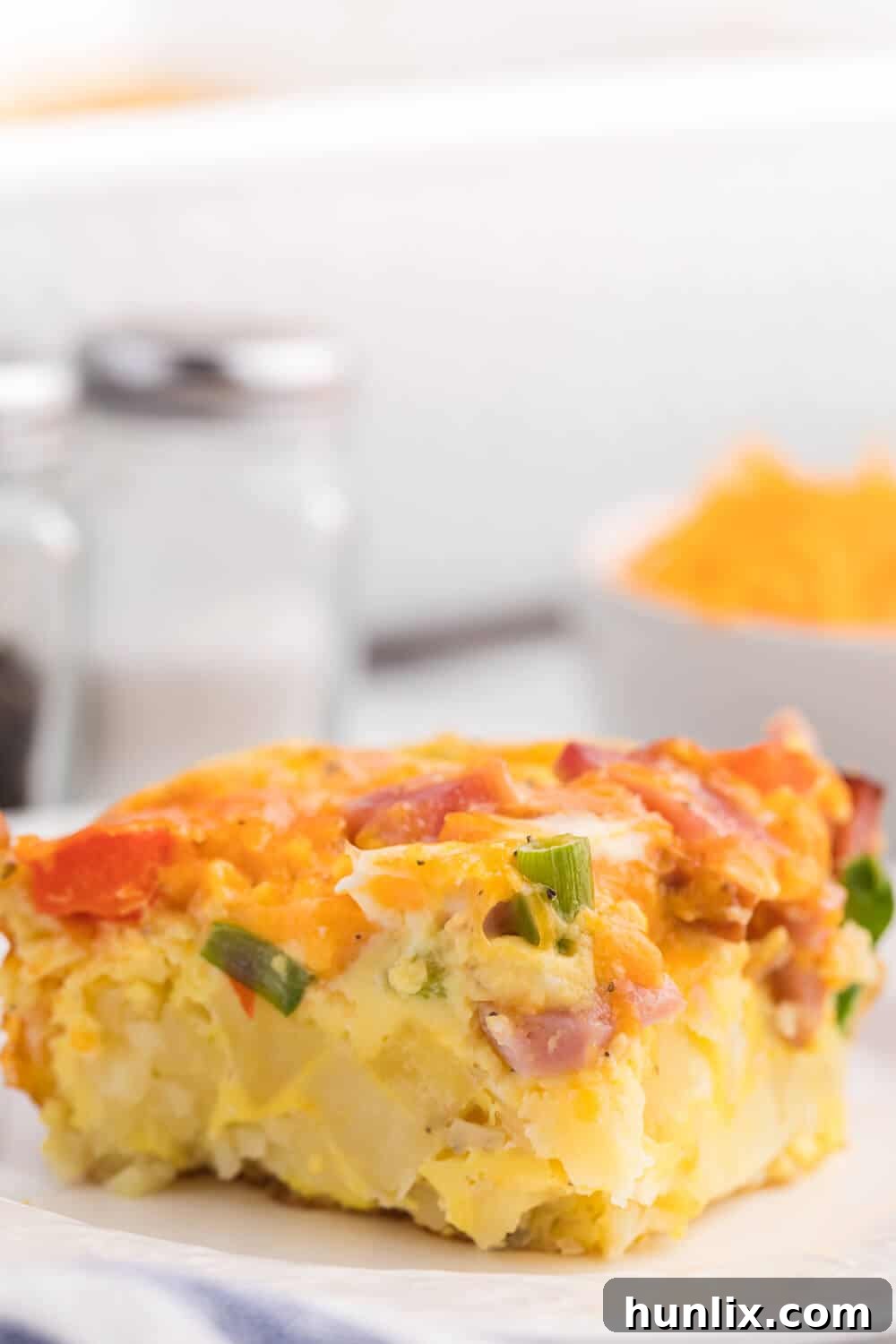 Golden Hash Brown Quiche 7 A slice of the recipe on a plate.