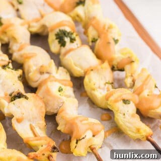 Chicken Satay with Peanut Sauce - This simple appetizer is a great crowd-pleaser! The homemade dipping sauce makes this easy recipe. Make them in the oven!