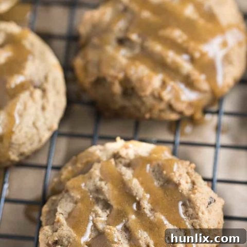 Soft and chewy brown sugar cookies with a delicate sugary glaze, ideal for holiday baking.