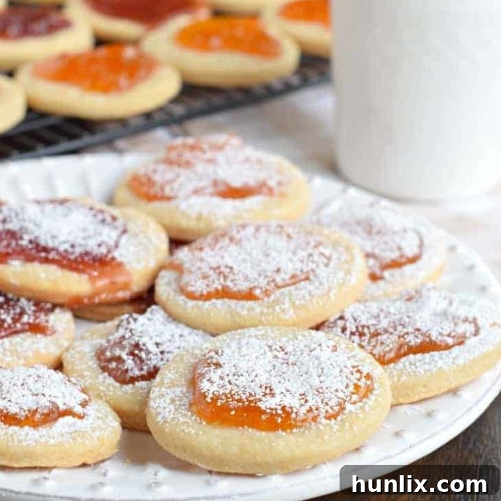 Traditional Kolachky cookies with a melt-in-your-mouth base and sweet fruit preserves.
