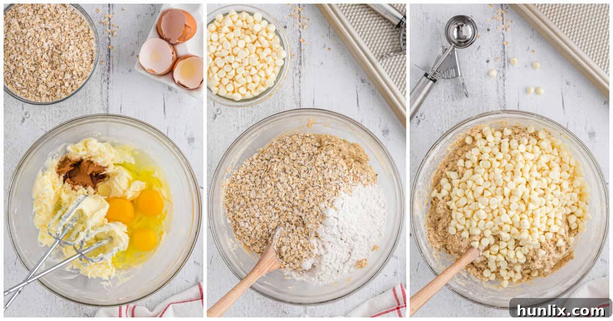 Close-up of cookie dough being mixed in a bowl, showing the texture and the white chocolate chips and oats folded in.