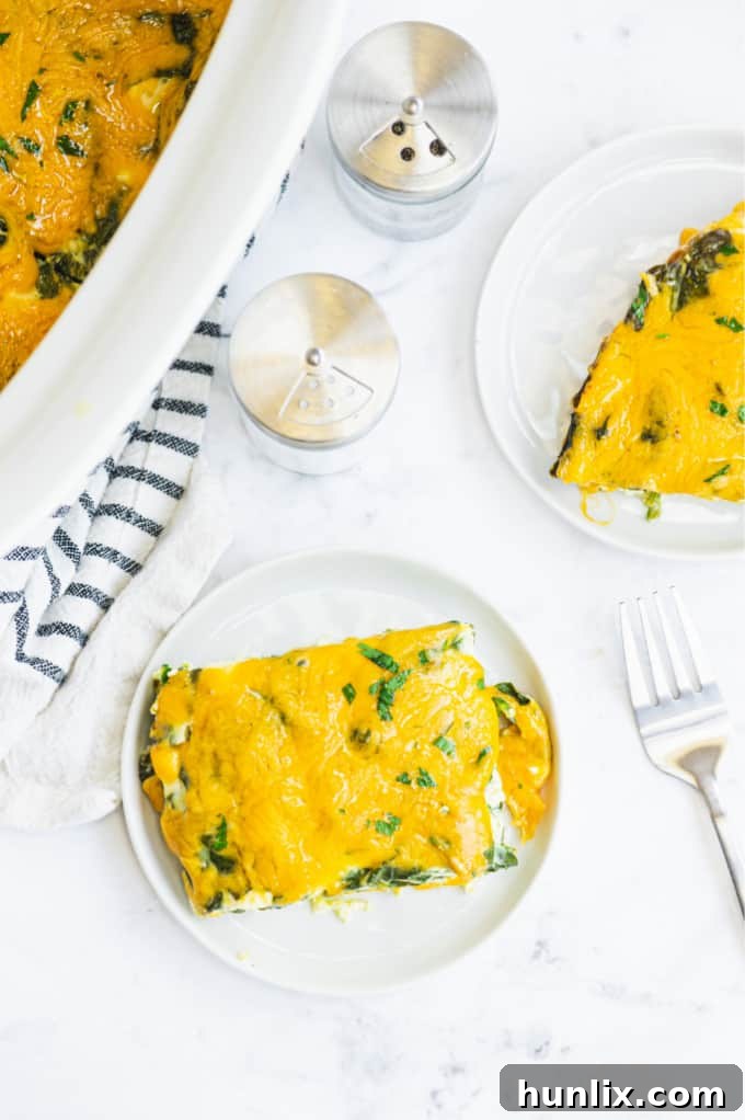 Ingredients laid out for Slow Cooker Spinach & Feta Quiche, including eggs, spinach, feta, and other cheeses, ready for preparation.