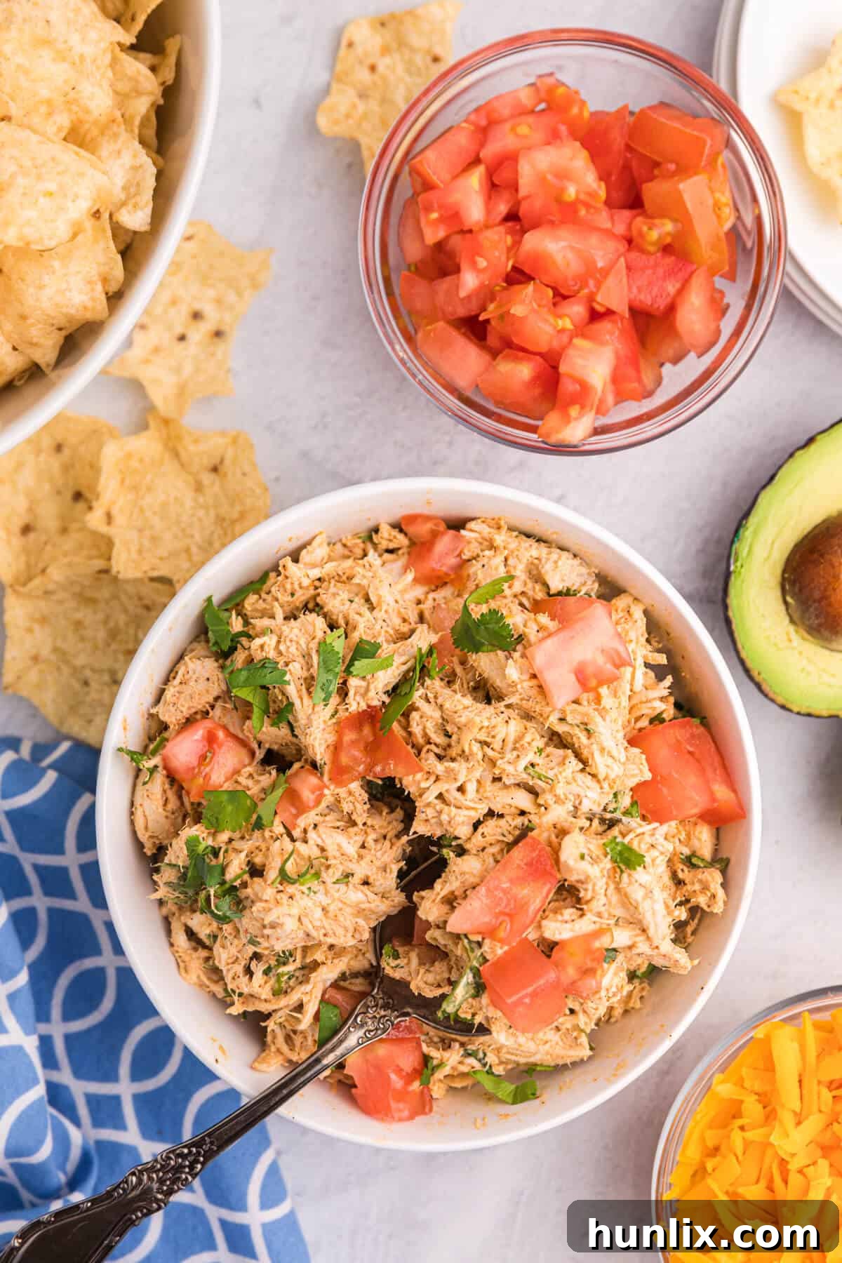 Fiesta Chicken Salad 2 A vibrant bowl of Taco Chicken Salad with a fork, ready to be enjoyed.