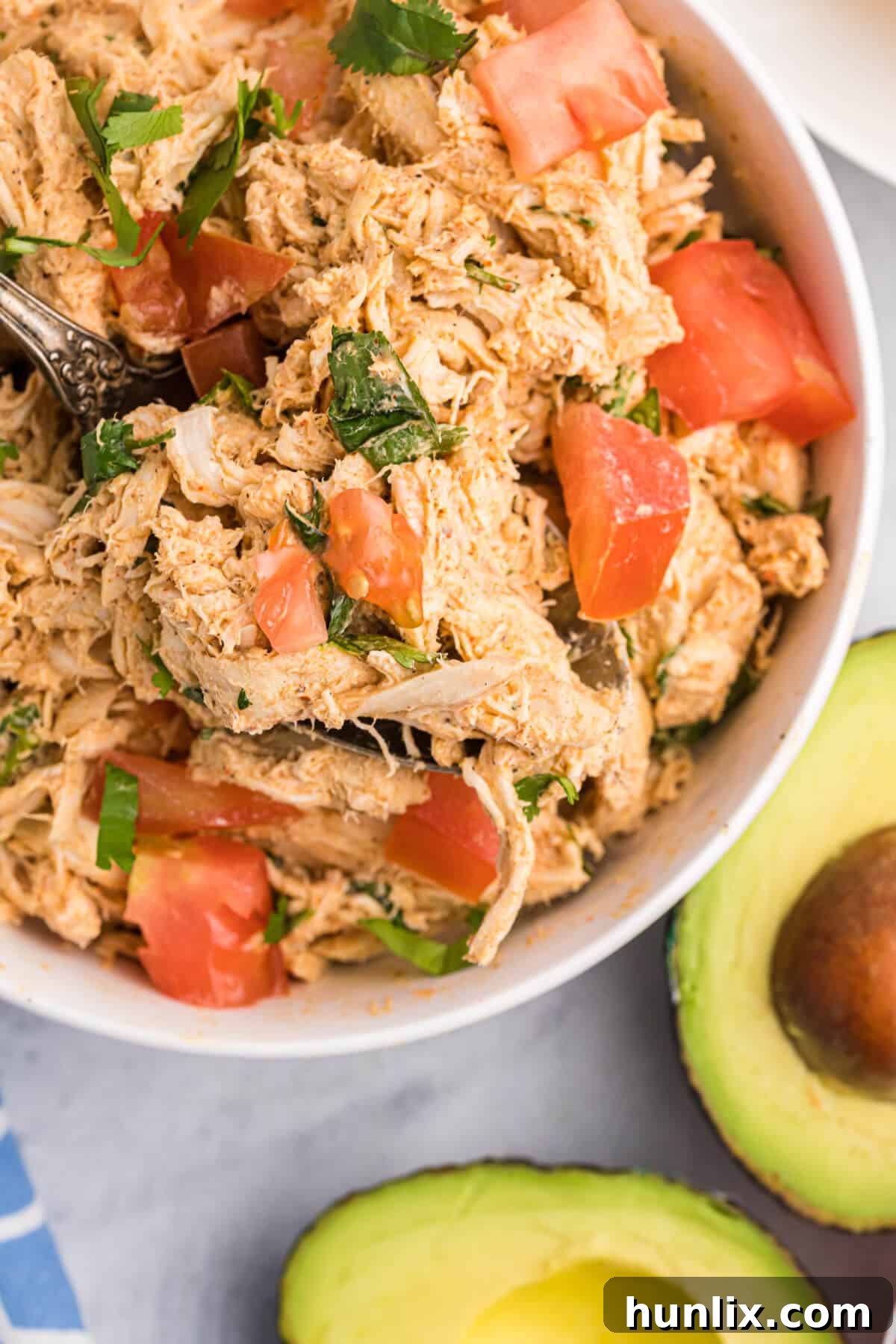 Fiesta Chicken Salad 6 A bowl of creamy taco chicken salad, garnished and ready to eat.