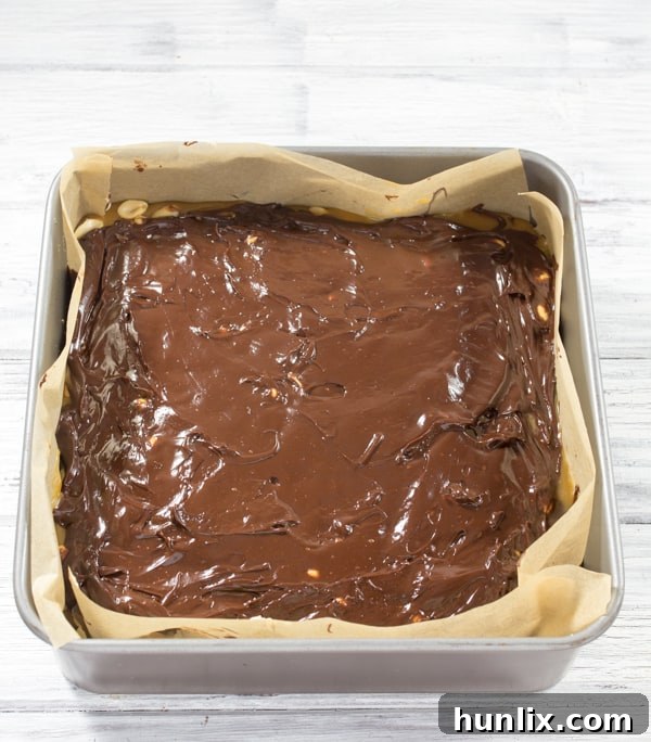 Decadent Snickers Stuffed Brownies 8 Snickers Brownies - rich and sweet with peanut nougat and salted caramel layers. You really don’t need much to satisfy that sweet tooth!