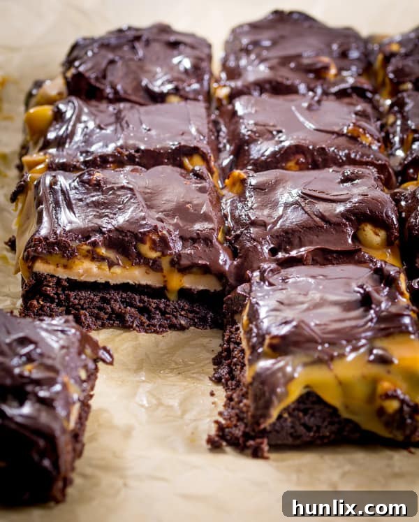 Decadent Snickers Stuffed Brownies 9 Snickers Brownies - Delicious AND gluten free! This decadent dessert recipe is a chocolate lover's dream with layers of nougat, peanuts, and caramel over a rich, moist brownie.