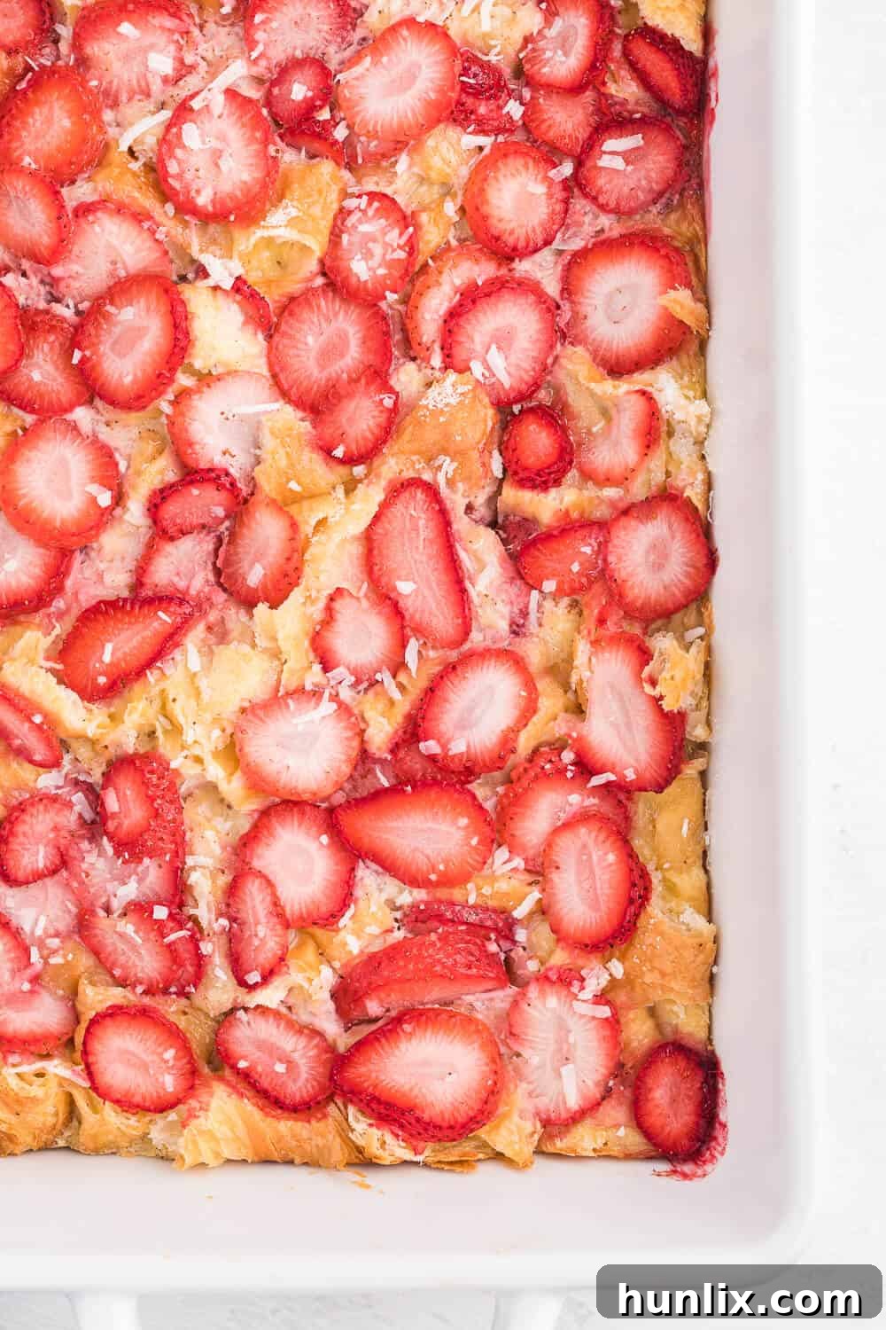 Strawberry & Coconut Breakfast Casserole - A quick and easy overnight breakfast casserole with beautiful strawberries and delicious coconut.