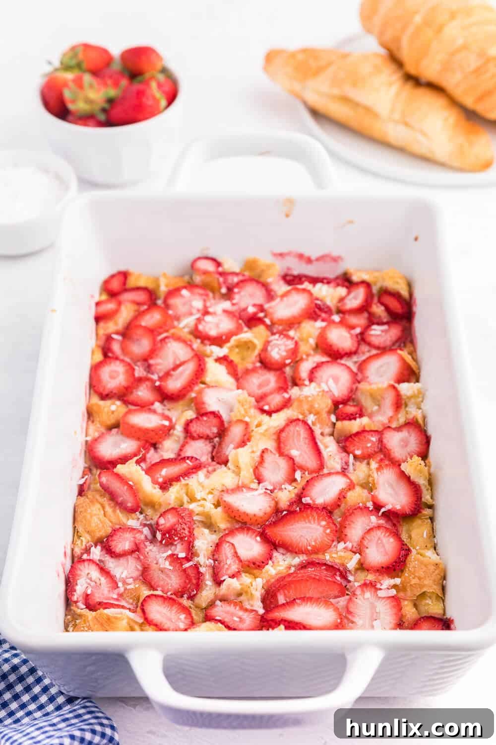 Strawberry & Coconut Breakfast Casserole - A delightful and simple overnight breakfast casserole with strawberries and a hint of tropical coconut.
