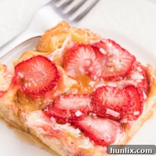 Strawberry & Coconut Breakfast Casserole - This is such a quick and easy overnight breakfast casserole to throw together. The strawberries add a beautiful colour, and the coconut is a delicious surprise flavour!