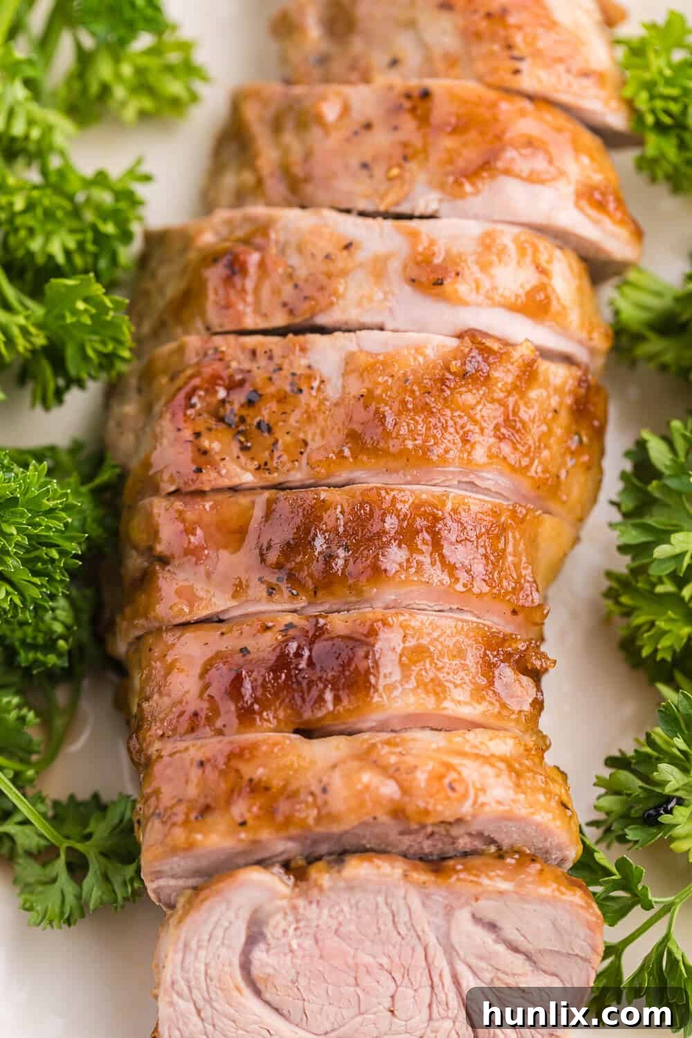 Brown Sugar Dijon Glazed Pork Tenderloin 3 Close-up of Brown Sugar Dijon Pork Tenderloin, highlighting the glossy glaze and tender meat, promising a delightful sweet and savory experience.