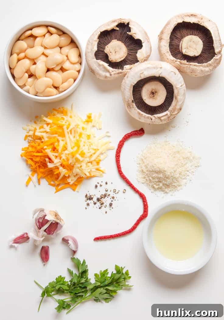 Creamy Butterbean and Cheese Stuffed Mushrooms 4 A collection of fresh ingredients laid out for making Cheese and Butterbean Stuffed Mushrooms.
