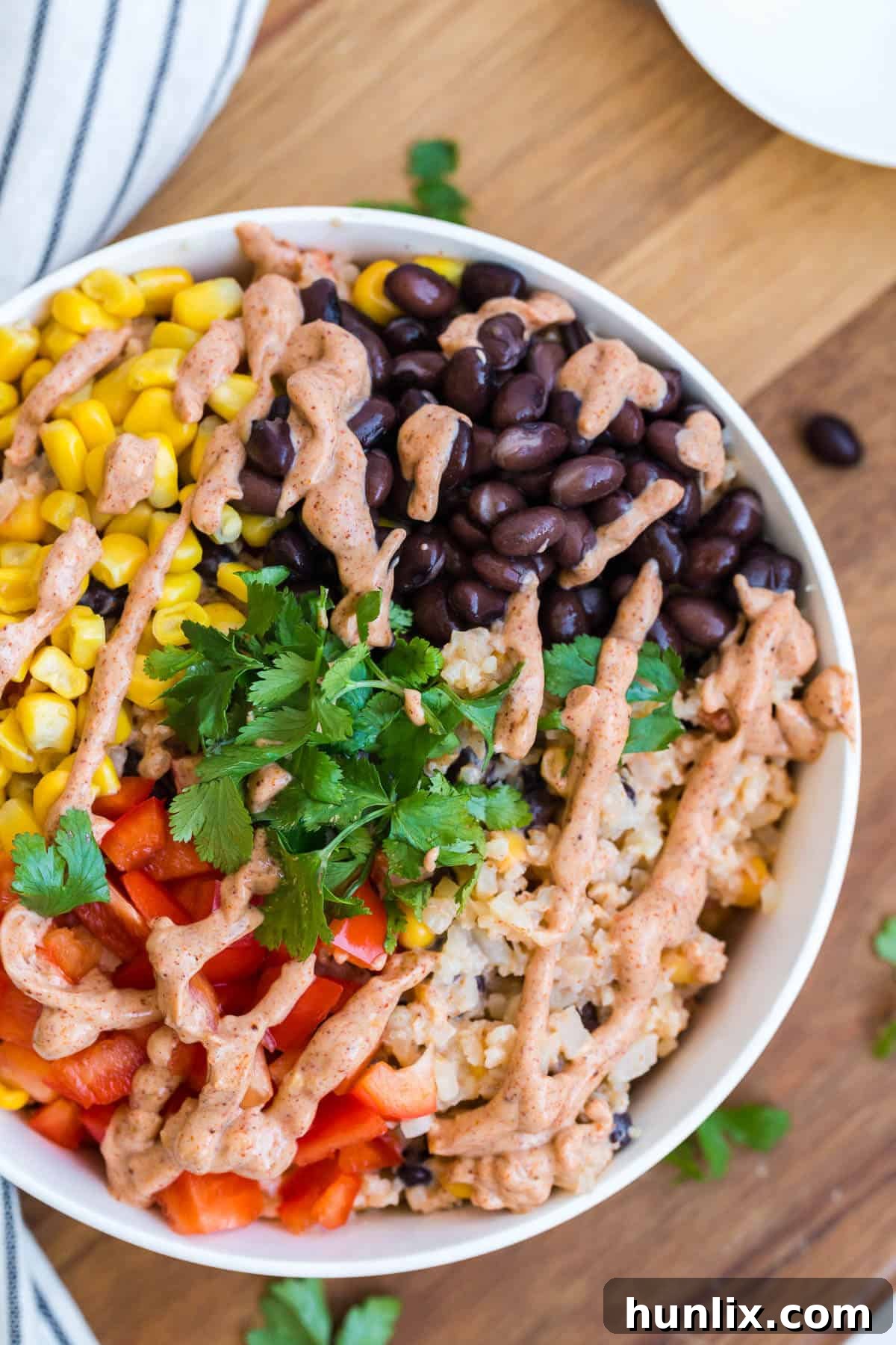 A vibrant bowl of cauliflower rice enchilada bowl, ready to be enjoyed.