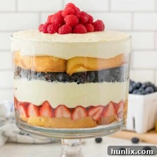 The finished Berry Cheesecake Trifle in a clear glass dish.