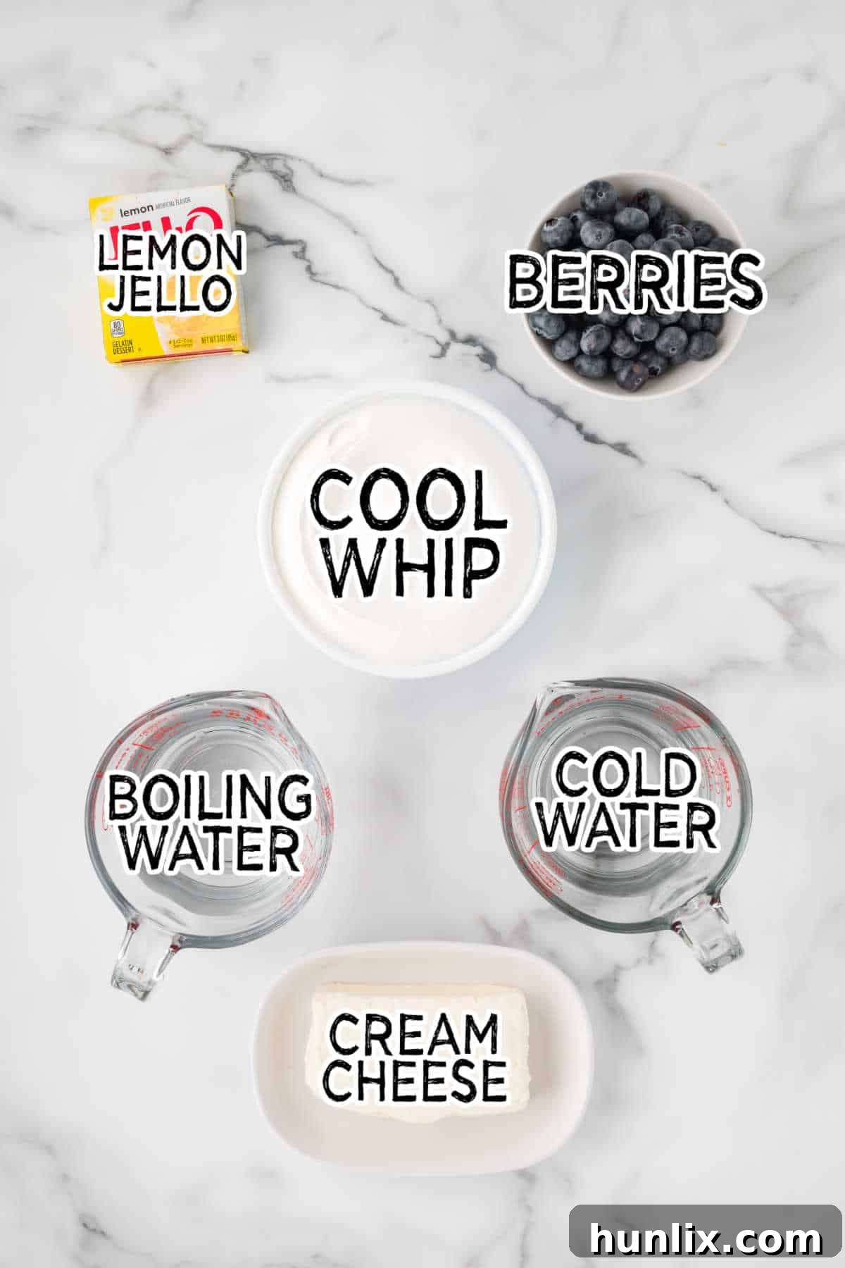 Lemon cheesecake mousse ingredients laid out on a table.