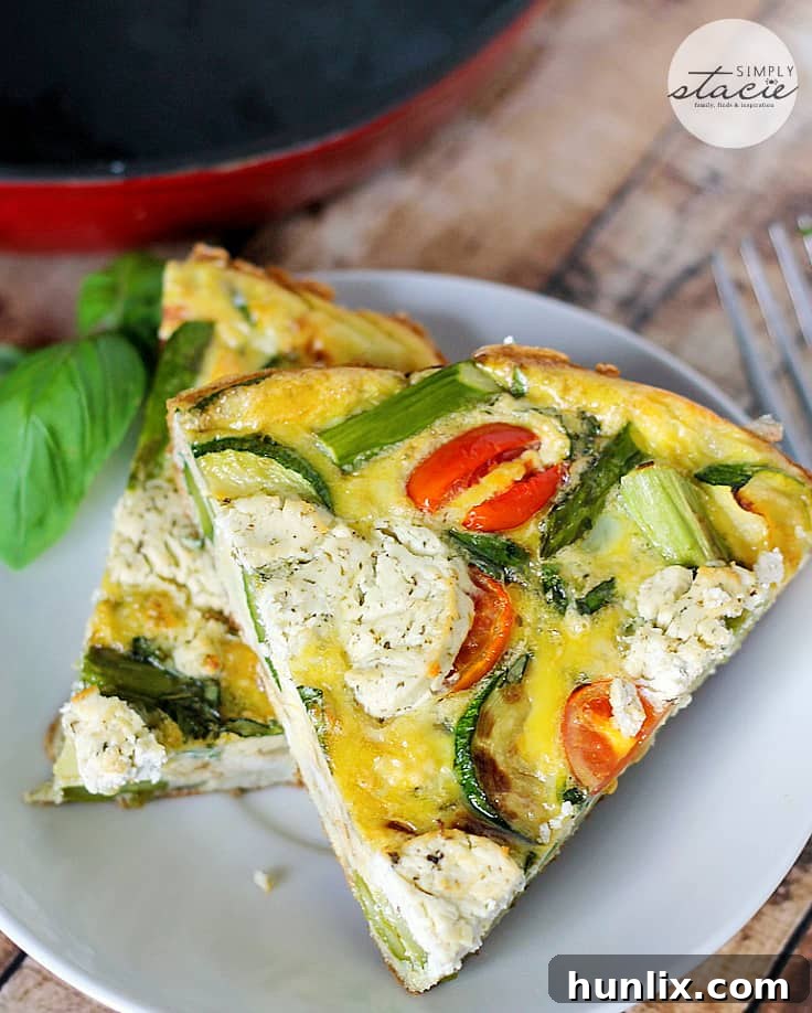 Spring Garden Frittata with Goat Cheese 3 Close-up of a frittata slice with visible goat cheese and spring vegetables