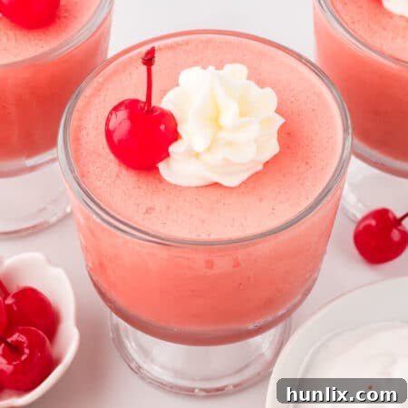 Cherry mousse in a parfait dish.