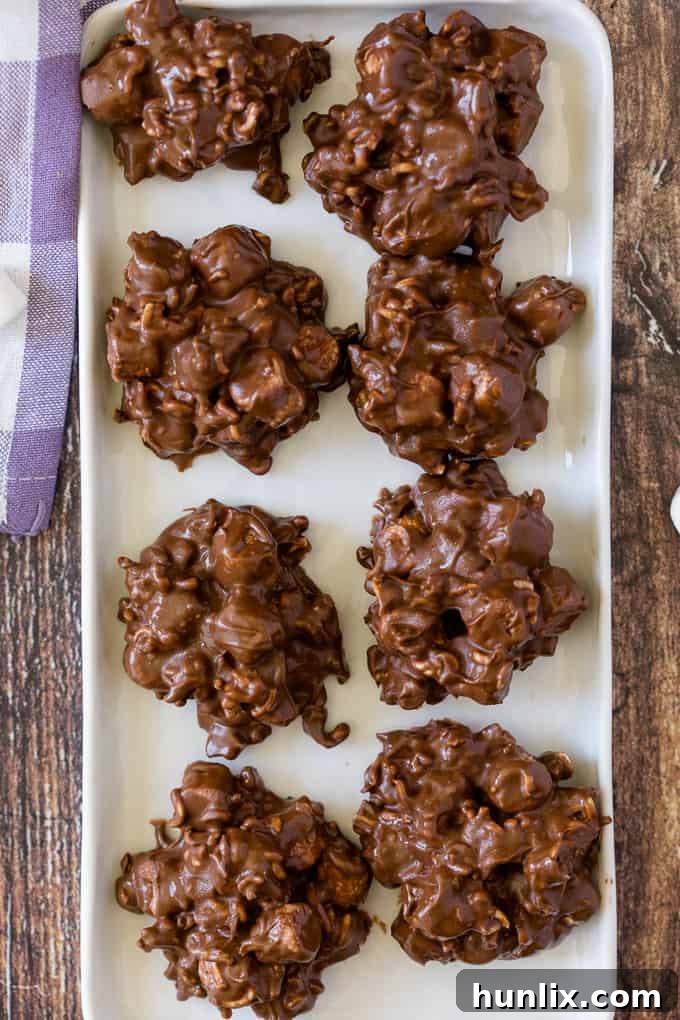 Rocky Road Bites - No-bake dessert alert! These sweet kitchen sink treats are covered in peanut butter PLUS chocolate and filled with gooey marshmallows and a crunchy surprise.