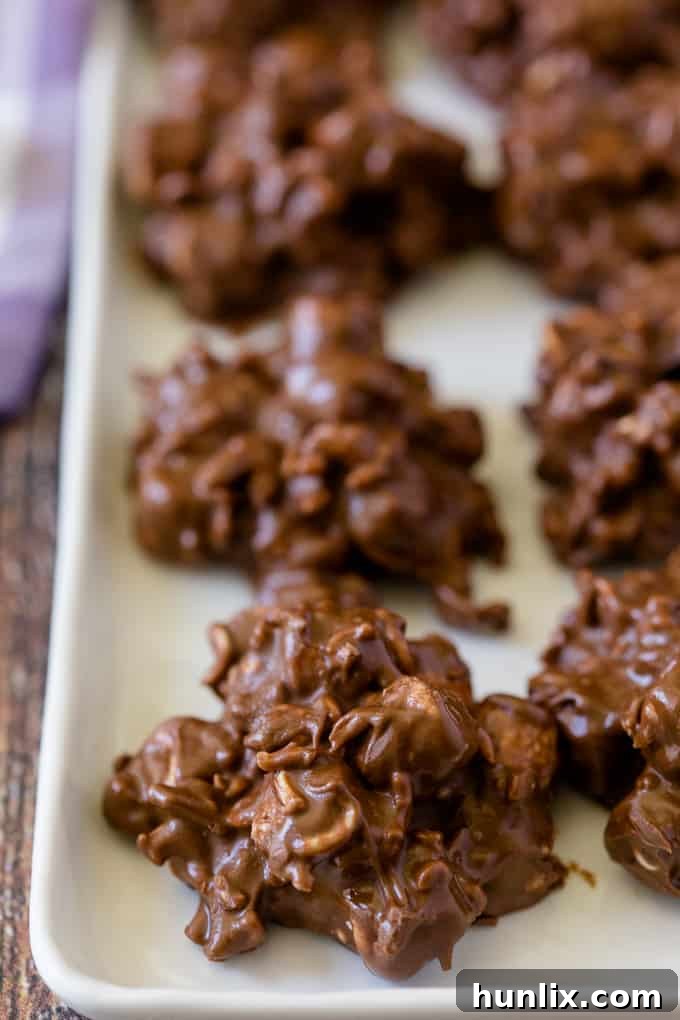 Rocky Road Bites - No-bake dessert alert! These sweet kitchen sink treats are covered in peanut butter PLUS chocolate and filled with gooey marshmallows and a crunchy surprise.