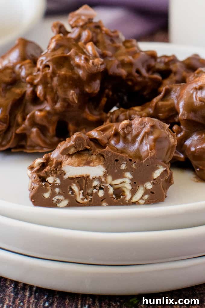 Rocky Road Bites - No-bake dessert alert! These sweet kitchen sink treats are covered in peanut butter PLUS chocolate and filled with gooey marshmallows and a crunchy surprise.
