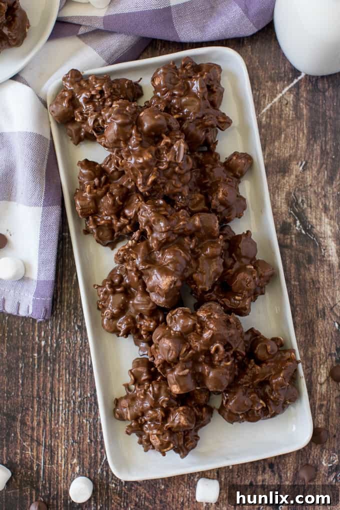 Rocky Road Bites - No-bake dessert alert! These sweet kitchen sink treats are covered in peanut butter PLUS chocolate and filled with gooey marshmallows and a crunchy surprise.