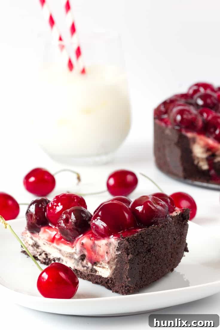 Decadent Cherry Oreo Cheesecake 4 Cherry Cheesecake with Oreo Crust - Chocolate and cherry combine for this decadent dessert! The sweet cheesecake filling melds perfectly with the crunchy cookie crust for a delicious and beautiful treat.
