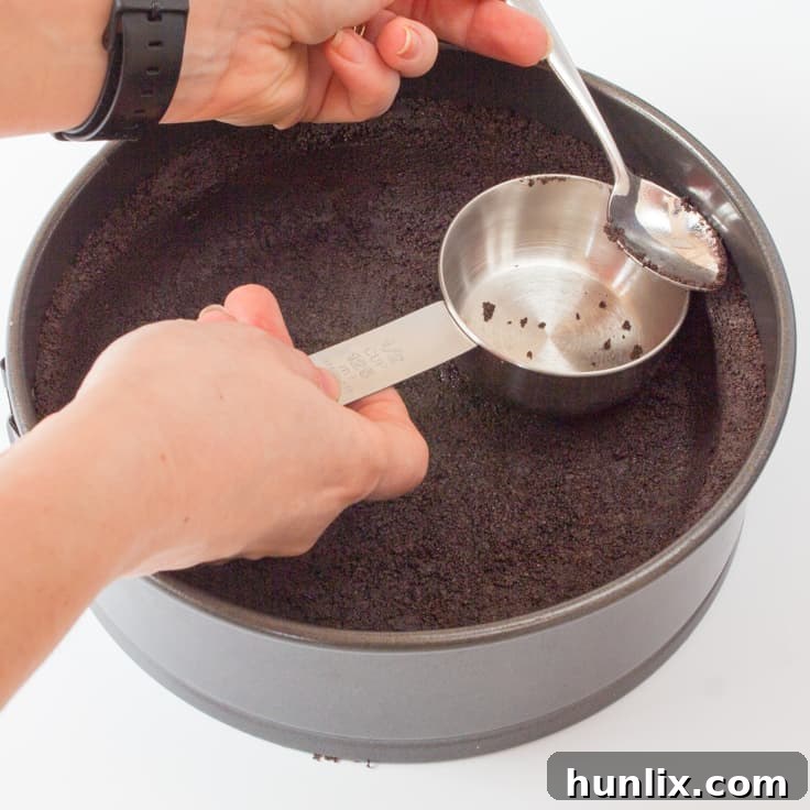 Decadent Cherry Oreo Cheesecake 5 Cherry Cheesecake with Oreo Crust - Chocolate and cherry combine for this decadent dessert! The sweet cheesecake filling melds perfectly with the crunchy cookie crust for a delicious and beautiful treat.