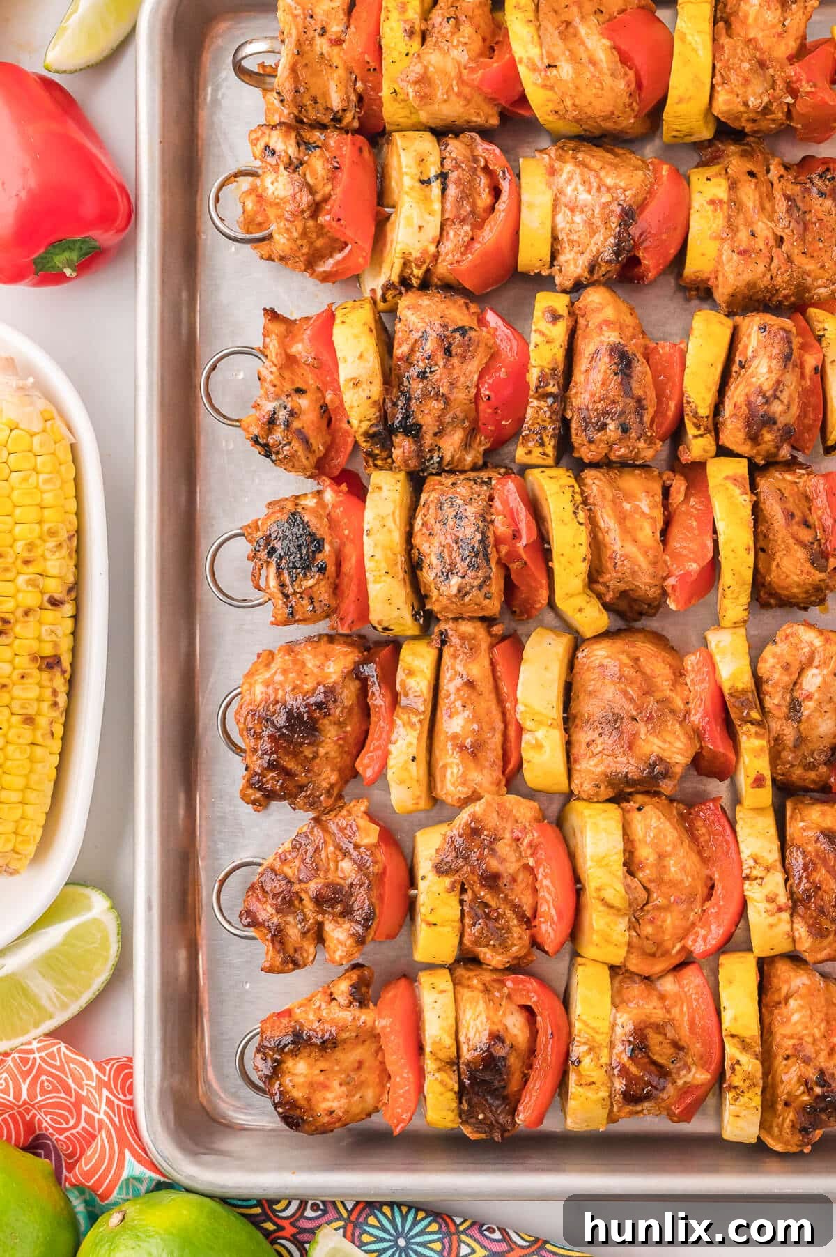 Cooked chipotle chicken skewers presented on a baking pan, ready to be served.