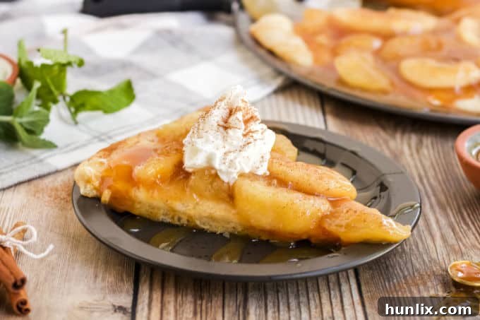 Caramel Apple Pizza - The PERFECT fall dessert pizza! Sweet cinnamon apple pie filling with rich caramel covering a basic pizza crust for the taste of pie without the mess and wait.