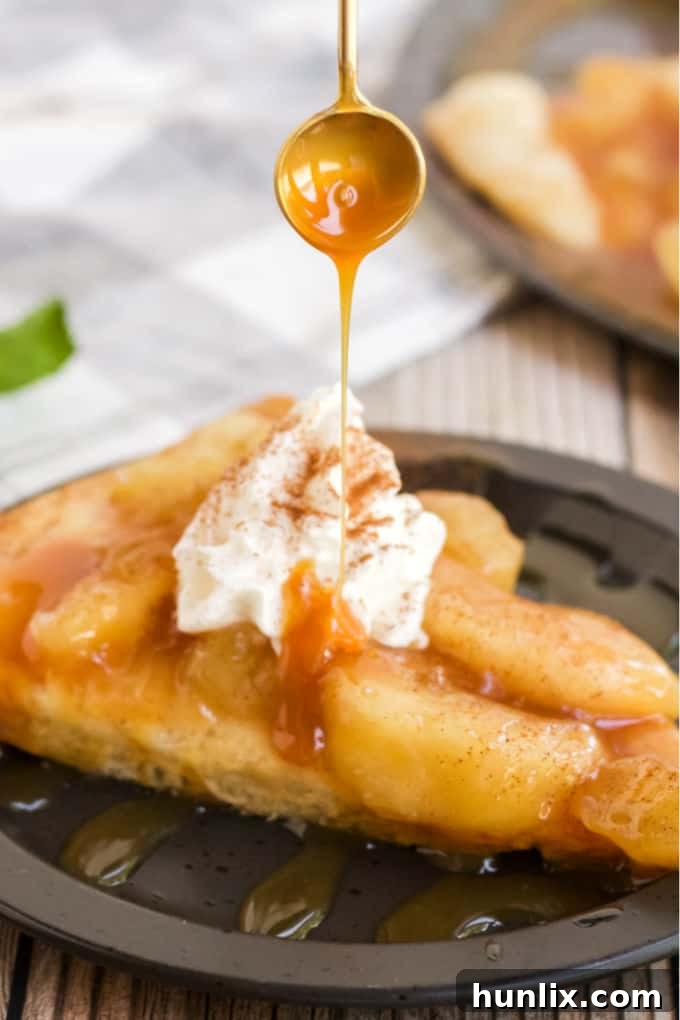 Caramel Apple Pizza - The PERFECT fall dessert pizza! Sweet cinnamon apple pie filling with rich caramel covering a basic pizza crust for the taste of pie without the mess and wait.