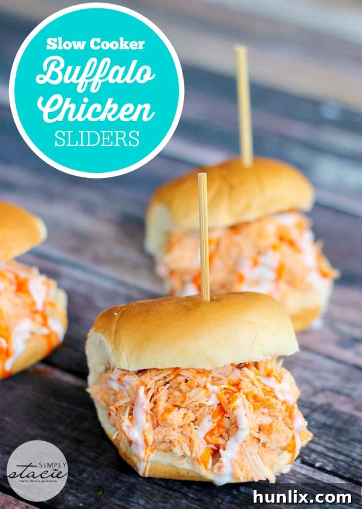 Close-up of a Slow Cooker Buffalo Chicken Slider, showcasing the shredded chicken and creamy ranch. Ideal for parties.