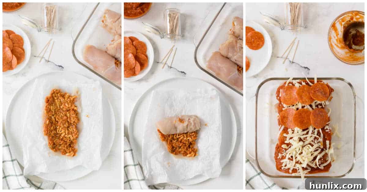 Rolled pizza stuffed chicken breasts arranged in a baking dish, topped with marinara, cheese, and whole pepperoni slices.
