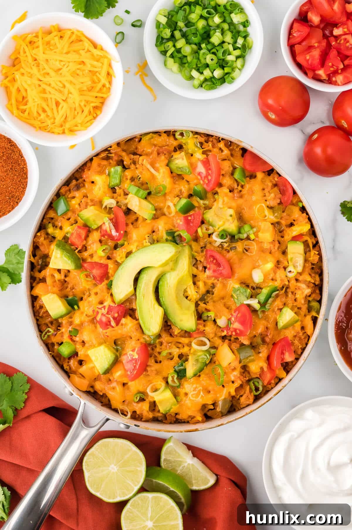 Chicken fajita rice in a pan, steaming hot and ready to serve.